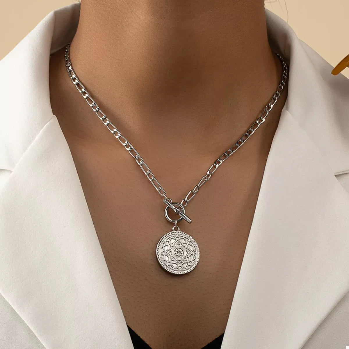 Vintage coin pendant chain link necklace from Plush Fashion Hub with a detailed coin charm on a silver-tone chain.