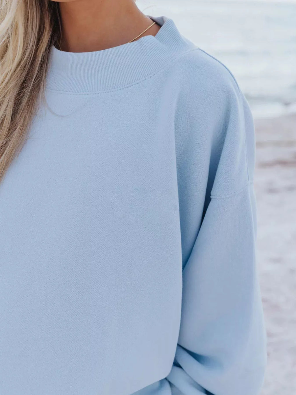 Relaxed fit round neck sweatshirt and shorts set by Trendsi, casual 2-piece loungewear set with comfortable fabric and relaxed style.