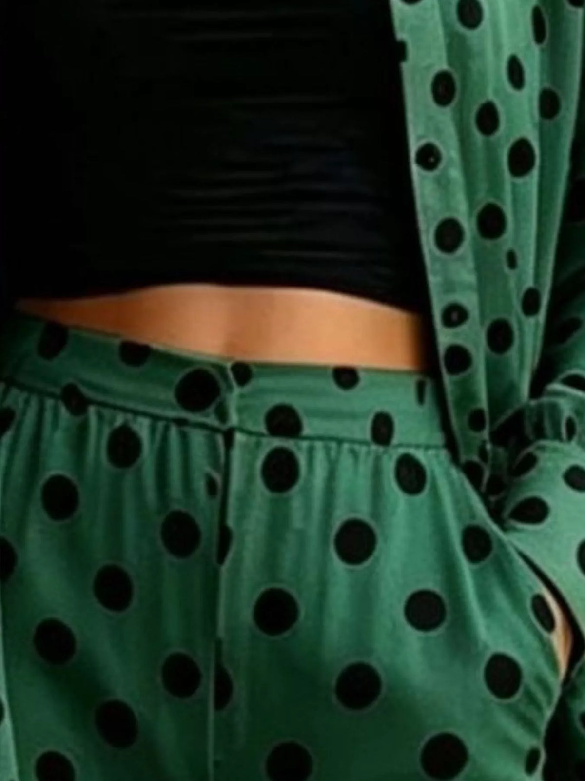 Plus size polka dot shirt and wide-leg pants set by Trendsi, featuring a stylish, comfortable matching outfit with bold polka dot pattern.
