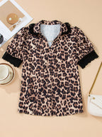 Leopard print short sleeve blouse by Trendsi with lace trim and button front, stylish top for casual or dressy wear.