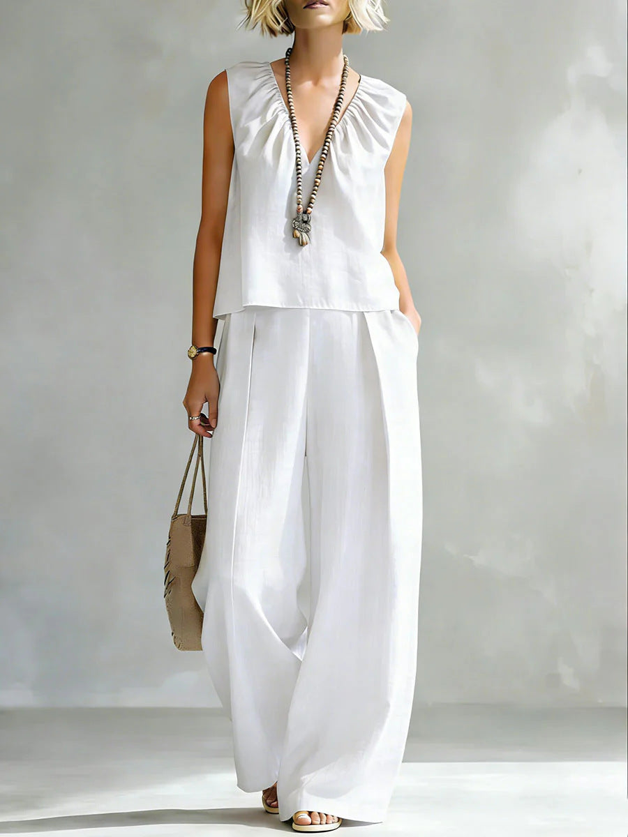 Women's sleeveless cotton-linen casual shirt and pants set by FitiqueFit, featuring a relaxed fit and breathable fabric.