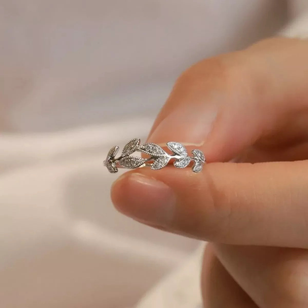 Sterling silver leaf ring with intricate leaf design, crafted by Plush Fashion Hub, showcasing detailed craftsmanship and elegant style.