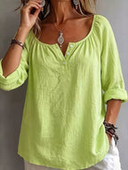 Button detail long sleeve top by Trendsi featuring a classic design with button accents and comfortable fabric.