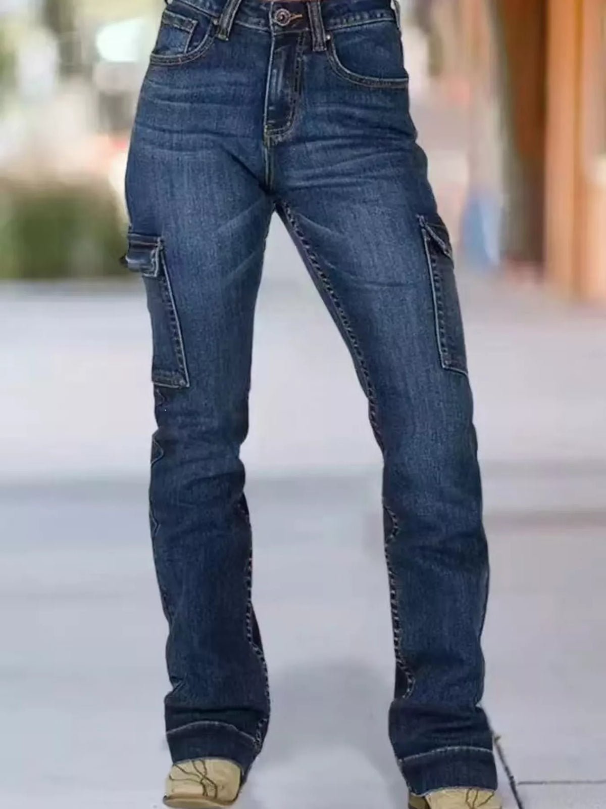 Wings embroidered high-rise cargo jeans by Trendsi featuring front pockets, relaxed fit, and detailed wing embroidery on the legs.