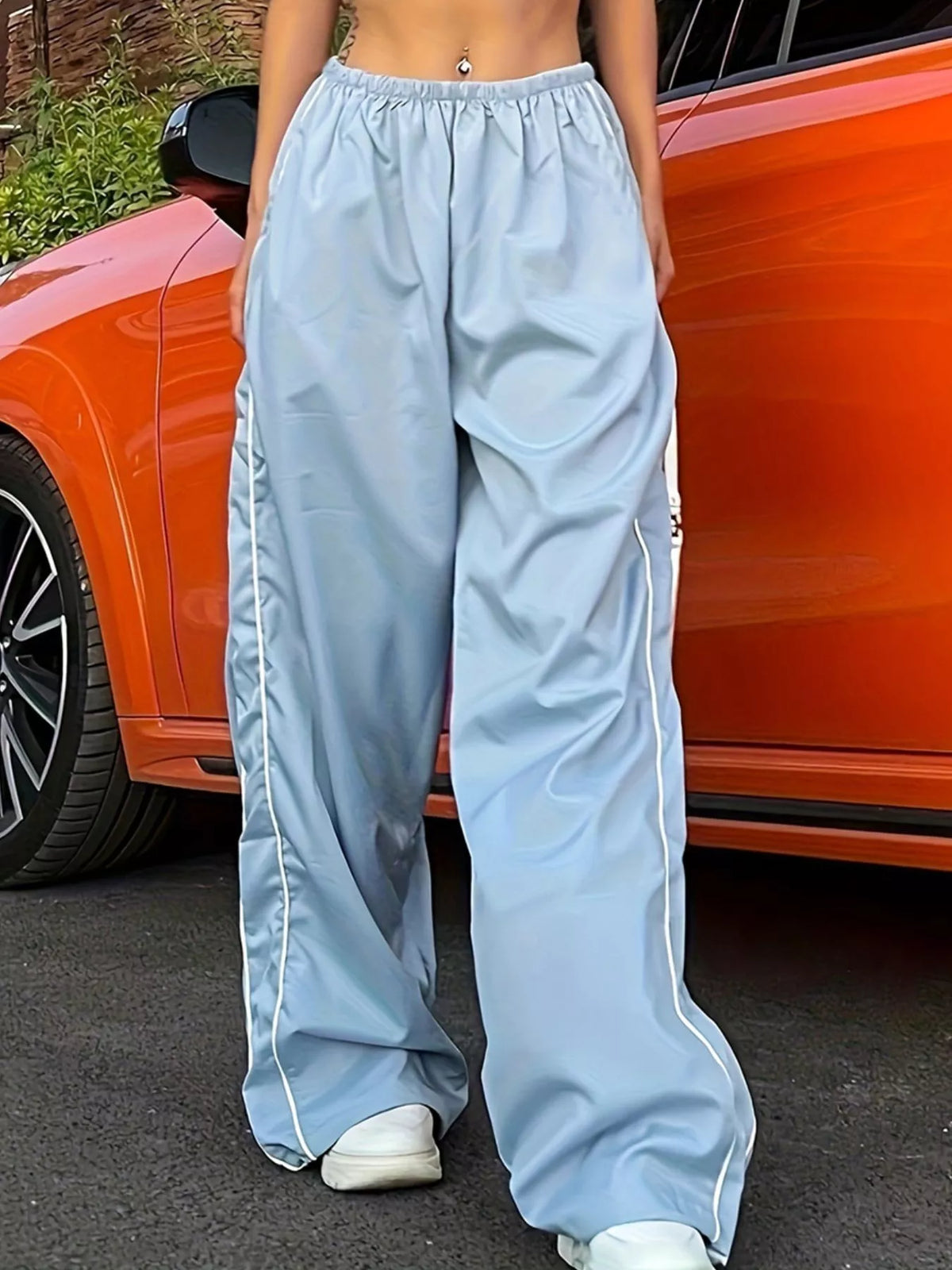 Women's lightweight high-rise wide-leg pants with elastic waist, stylish dress from Plush Fashion Hub, shown in natural fabric and fit.