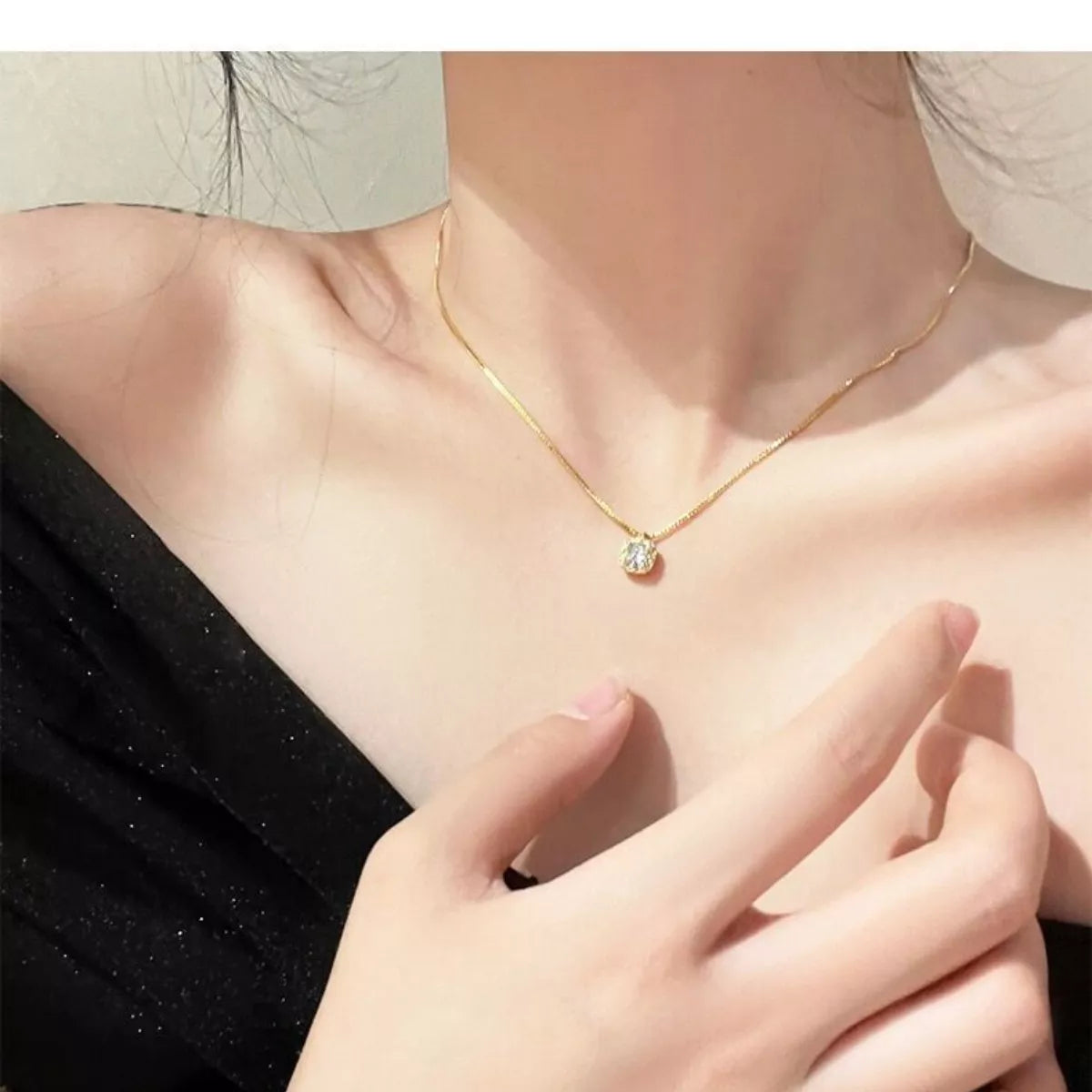 Sterling silver zircon pendant necklace with elegant design, showcasing a sparkling gemstone on a delicate chain.