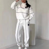 Women's hoodless pullover sweatsuit set in white with stylish stripes and pockets, perfect for comfortable lounge wear.