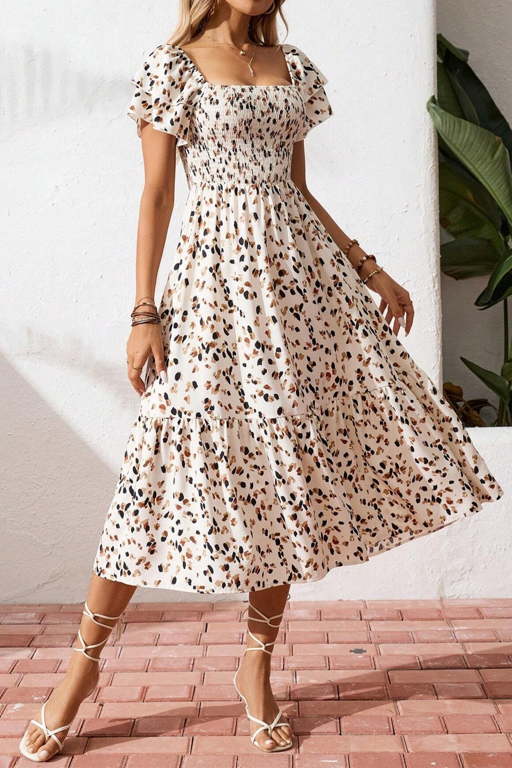 Women's square neck ruffle sleeve smocked midi dress made of cotton blend, featuring a stylish and comfortable design.