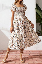 Women's square neck ruffle sleeve smocked midi dress made of cotton blend, featuring a stylish and comfortable design.