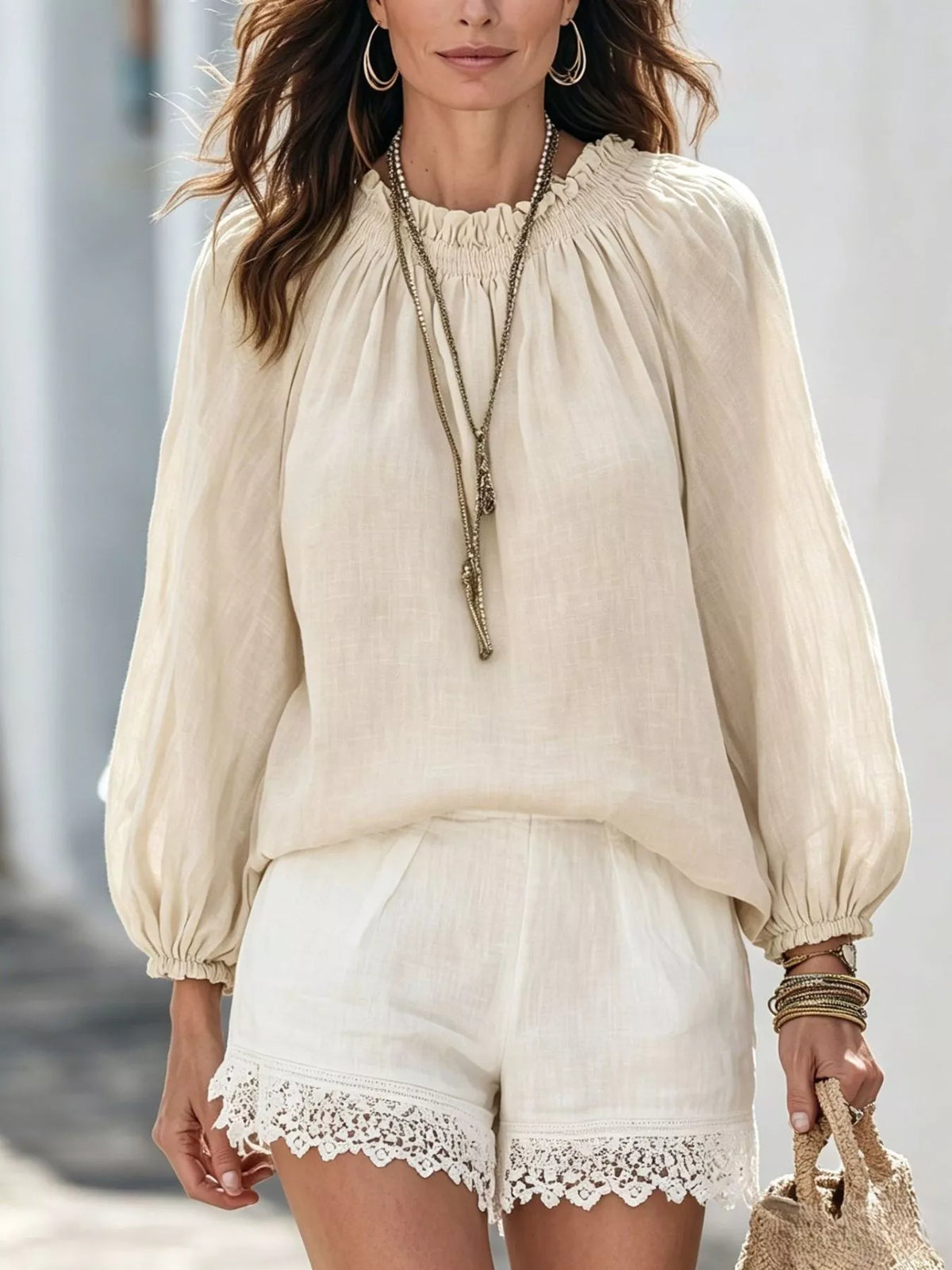 Women’s round neck balloon sleeve blouse by Trendsi, featuring lightweight fabric and stylish design, shown on a model.