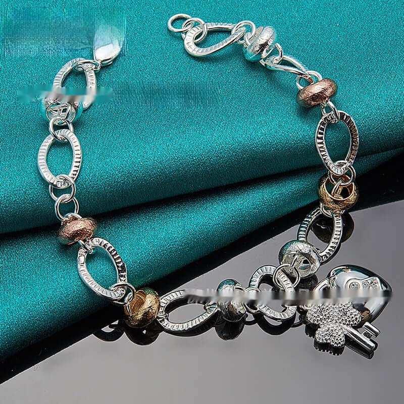 Silver Love Key Bracelet Female JewelryUnlock your style with our Silver Love Key Bracelet! Its retro, ethnic design is perfect for adding a touch of uniqueness to any outfit. The metal material ensures dJewelryPlush Fashions ShopPlush Fashion Shop