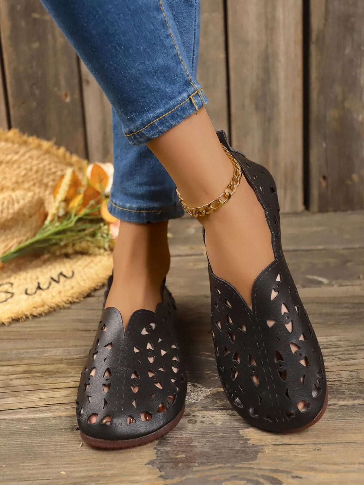 Perforated leather slip-on loafers by Trendsi, stylish footwear with breathable design and classic loafer appearance.