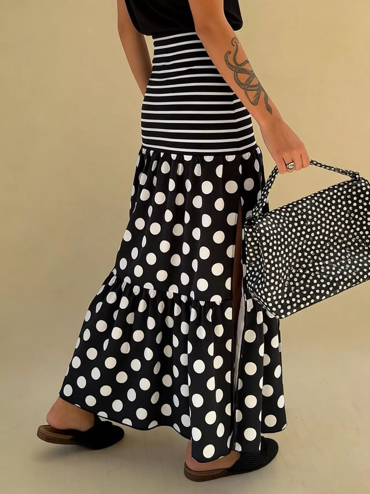 Flowy women’s polka dot and striped maxi skirt with a slit, casual bohemian style from Plush Fashion Hub, featuring a comfortable, breezy design.