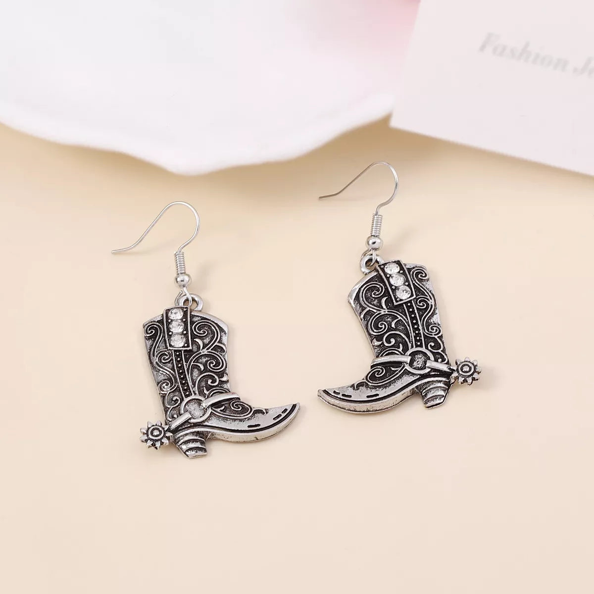 Vintage Western cowboy boot dangle earrings by Plush Fashion Hub, featuring detailed leather boot design and rustic metal accents.
