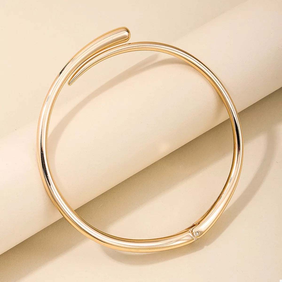 18K gold-plated alloy adjustable necklace with delicate chain and subtle shine, displayed on a neutral background.