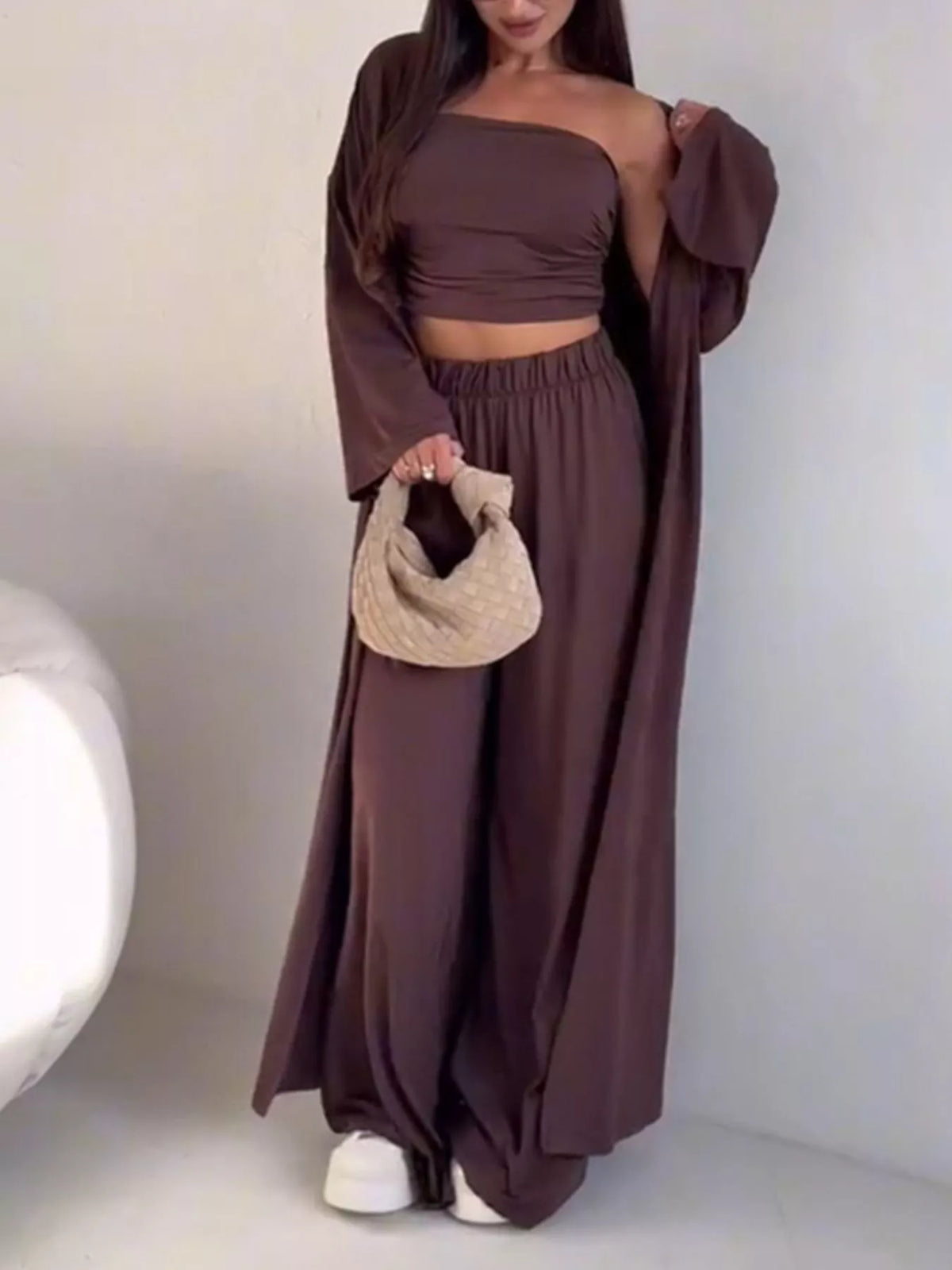 Trendsi chic 3-piece set with strapless ruched crop top, wide-leg pants, and matching cardigan, styled in a modern, coordinated look.