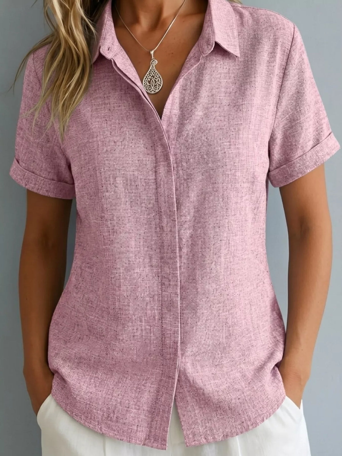 Plus size collared short sleeve shirt from Trendsi, featuring a classic button-up design and a comfortable fit.