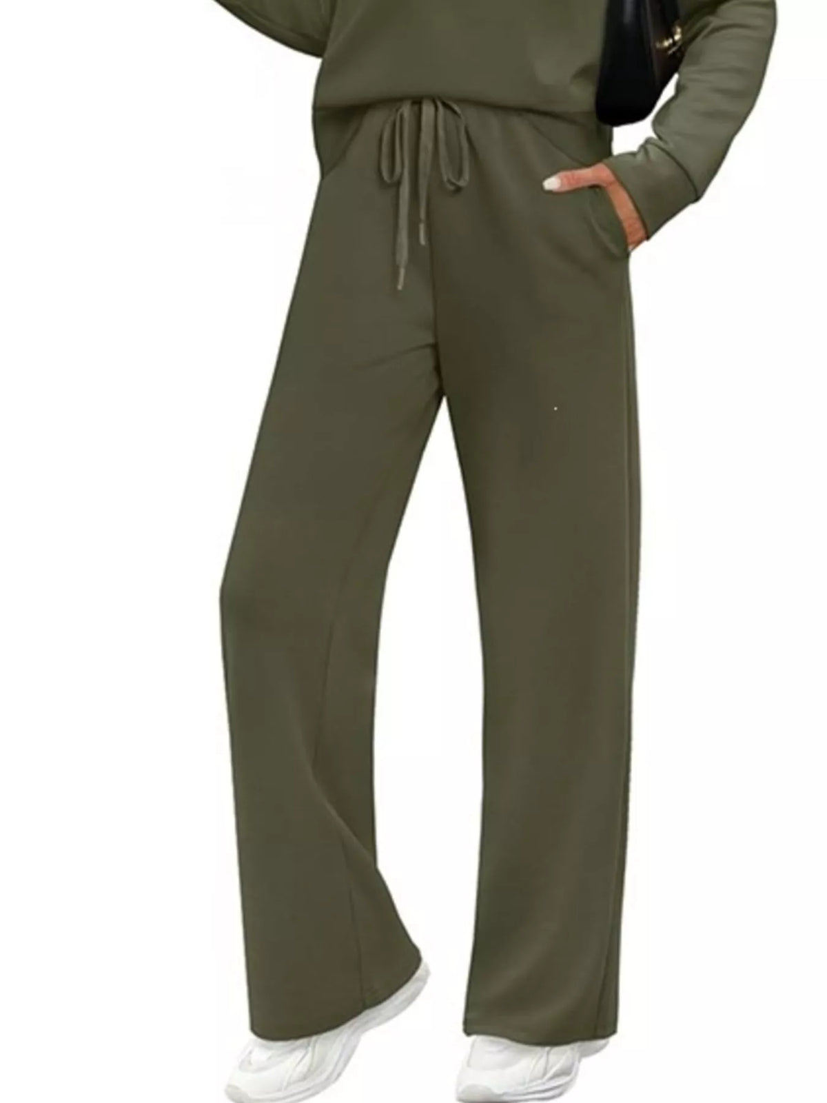 Plus size casual long sleeve crewneck top and drawstring pants matching set by Trendsi, featuring comfortable fabric and relaxed fit.