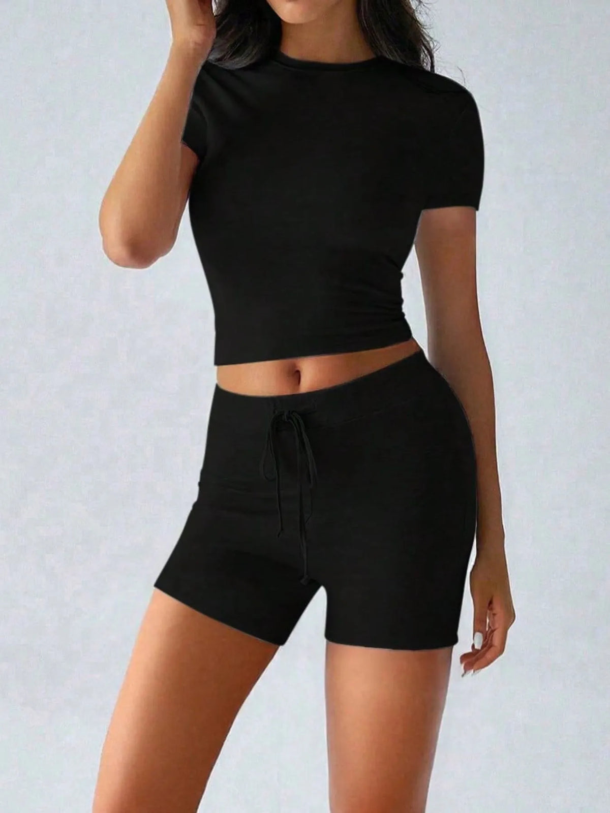 Plush Fashion Hub active wear set with round neck short sleeve top and matching shorts, perfect for workout or casual wear.