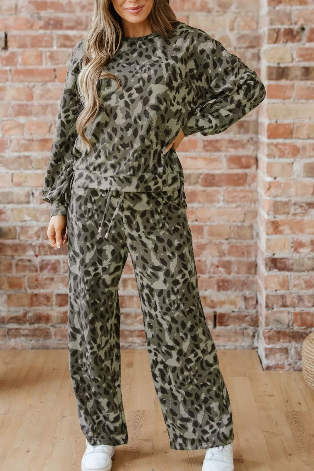 Leopard print long sleeve top and matching pants set by Trendsi, featuring a stylish animal print design and comfortable fit.