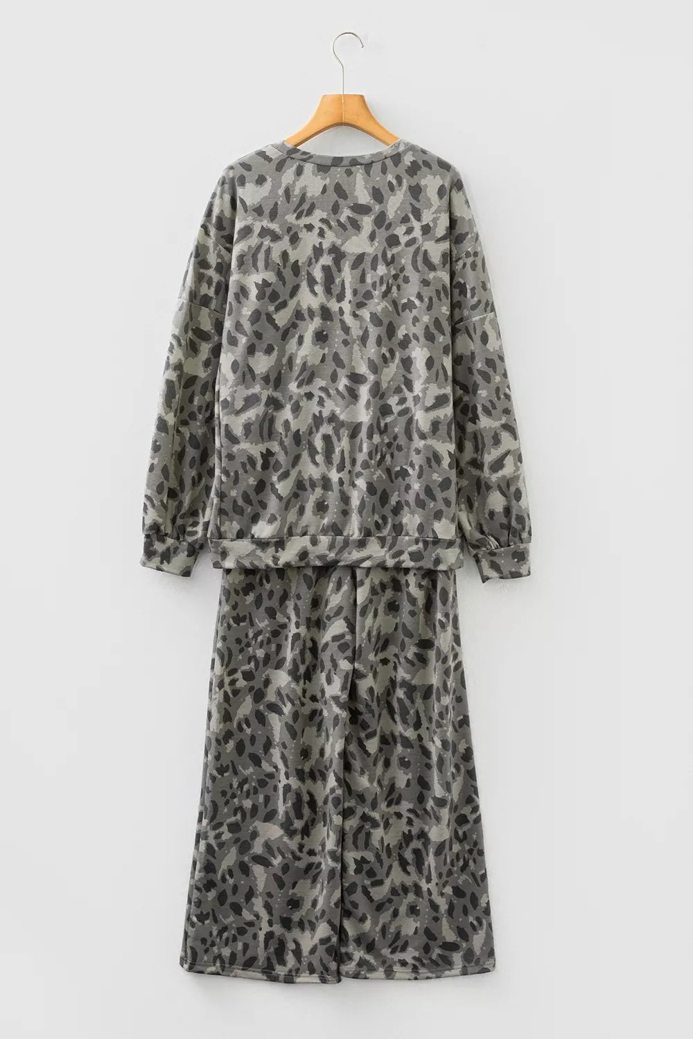 Leopard print long sleeve top and matching pants set by Trendsi, featuring a stylish, coordinated animal print outfit.
