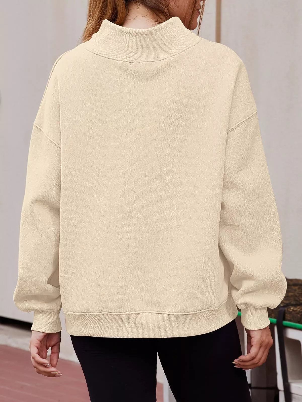 Women’s oversized mock neck sweatshirt with dropped shoulders in casual style, by Plush Fashion Hub, shown in black on a model.