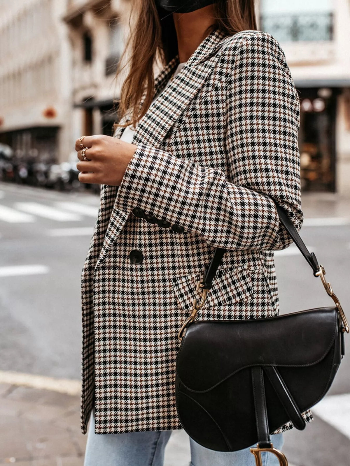 Classic houndstooth double-breasted blazer from Trendsi, featuring tailored fit and stylish pattern, displayed on a hanger.