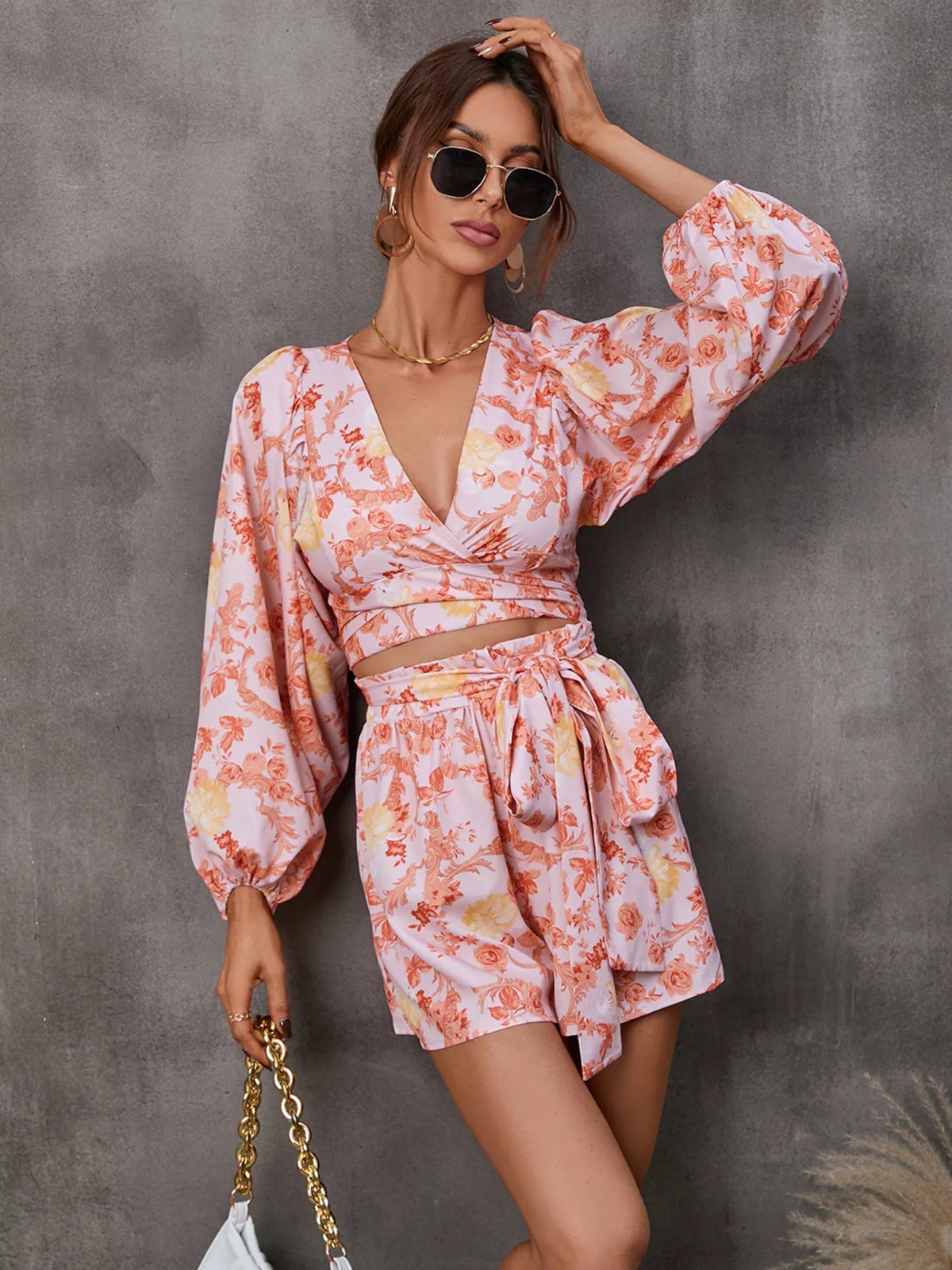 Printed long sleeve romper with cutout front, Plush Fashion Hub jumpsuit, featuring stylish design and comfortable fit.