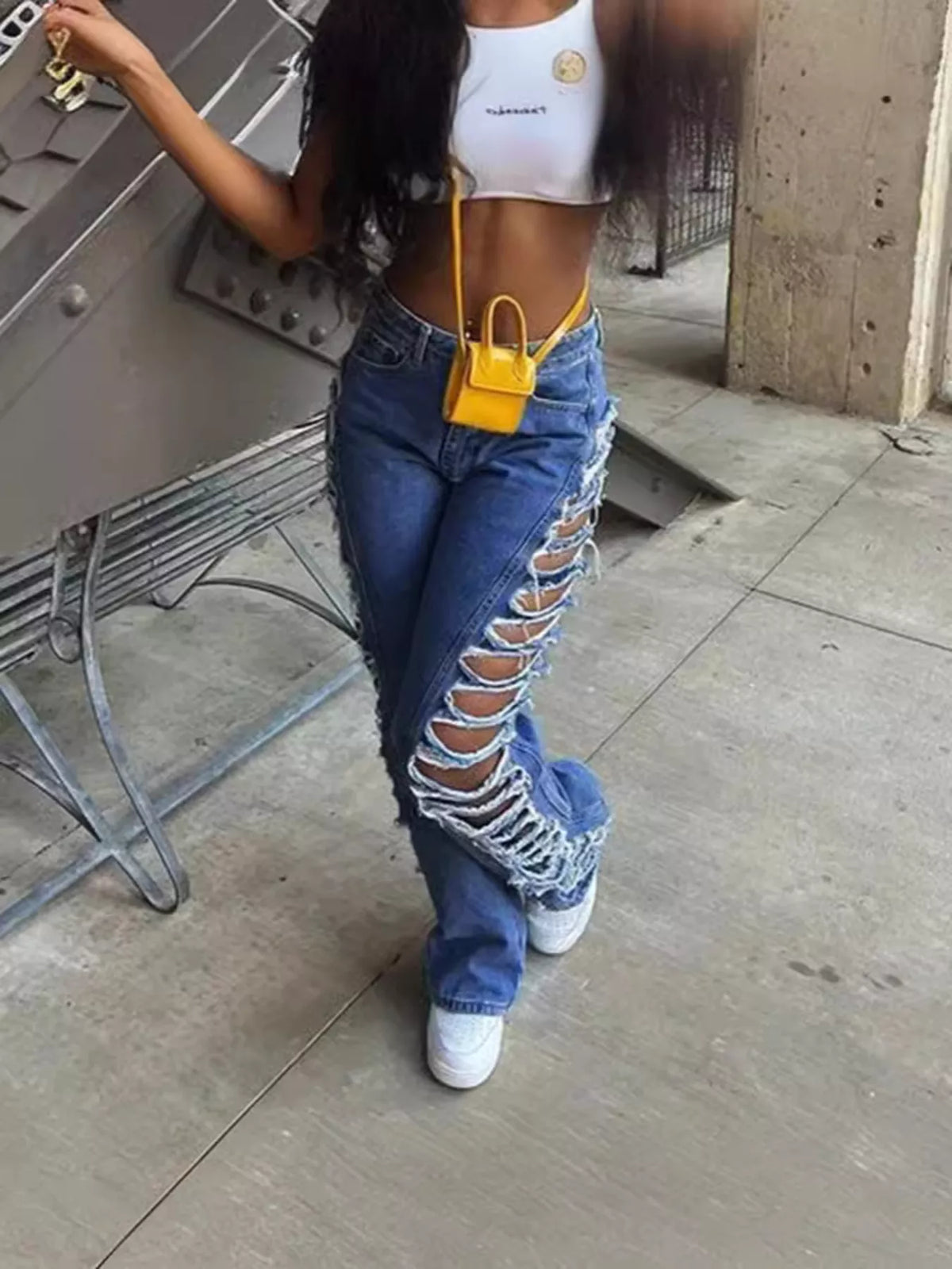Distressed denim jeans by Plush Fashion Hub featuring a side ripped design and classic blue denim fabric.