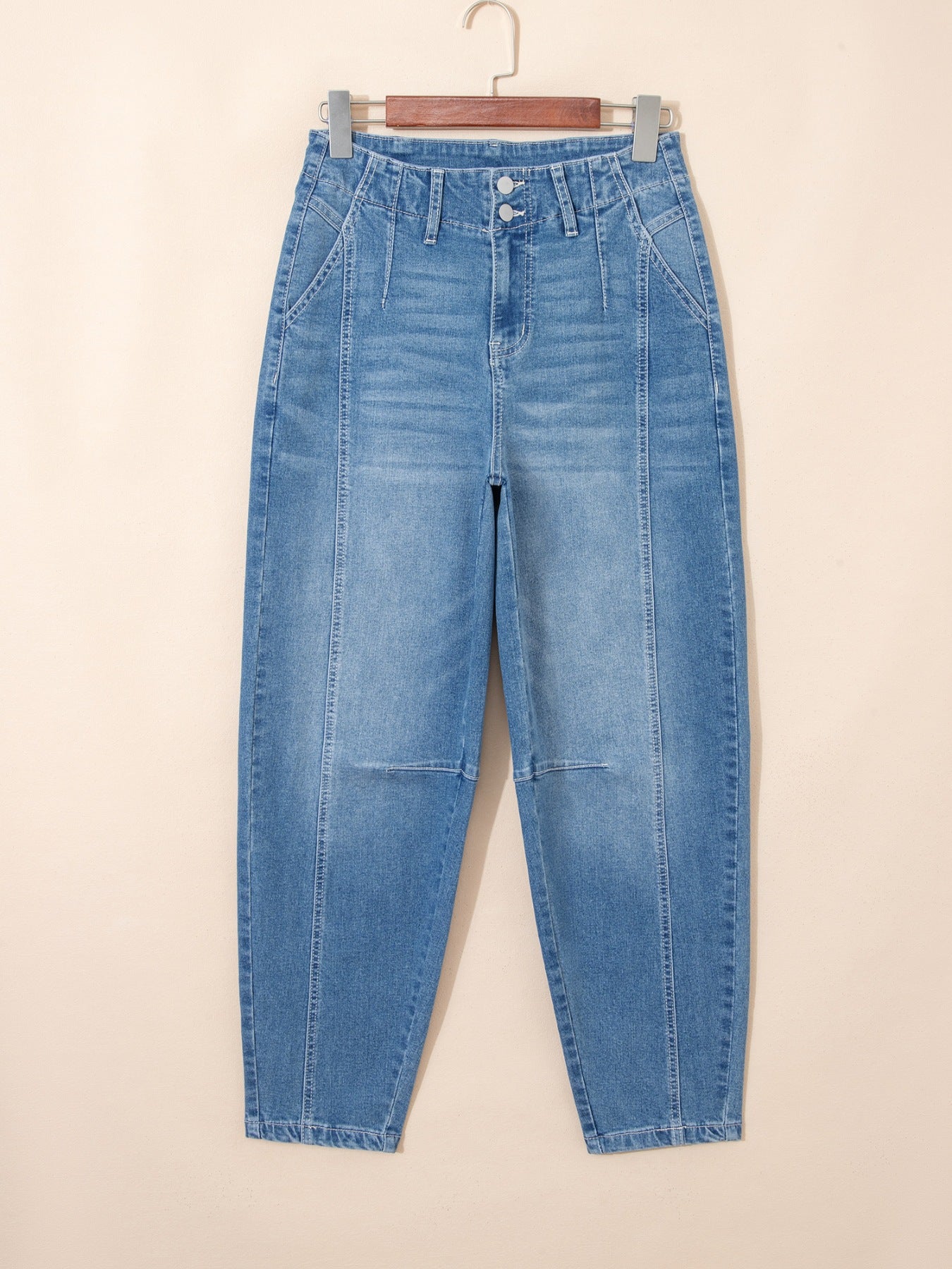 Washed cuffed barrel leg jeans in vintage relaxed fit denim, showing distressed details and classic blue wash from Trendsi.