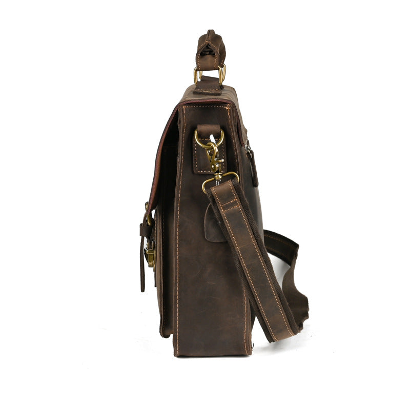 Pi-Mart leather one-shoulder crossbody laptop bag with top flap and adjustable strap, stylish bag for carrying laptops and accessories.