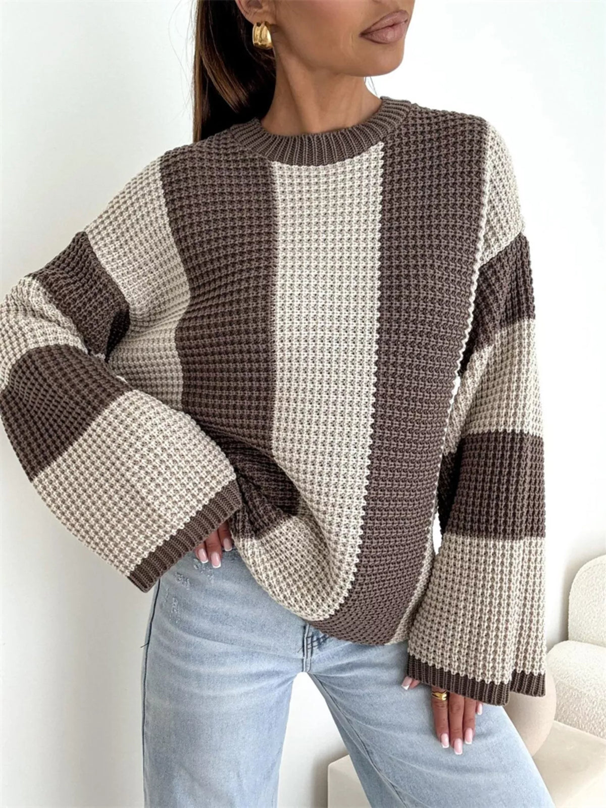 Color block long sleeve sweater by Trendsi, featuring vibrant color blocking and cozy knit fabric, displayed on a mannequin.