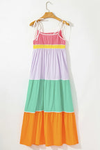Women's 100% cotton color block tiered maxi dress with pockets, featuring a flowing silhouette and vibrant design.