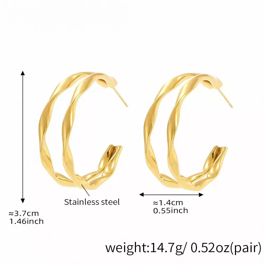 Gold-plated chunky twisted hoop earrings from Plush Fashion Hub, showcasing bold, twisted hoop design with a shiny finish.
