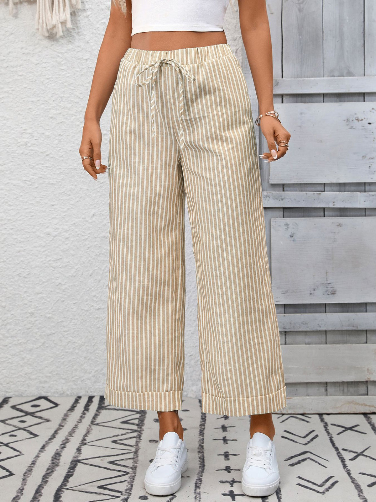 Women’s striped wide-leg drawstring pants with pockets by Plush Fashion Hub, featuring a relaxed fit and casual style.