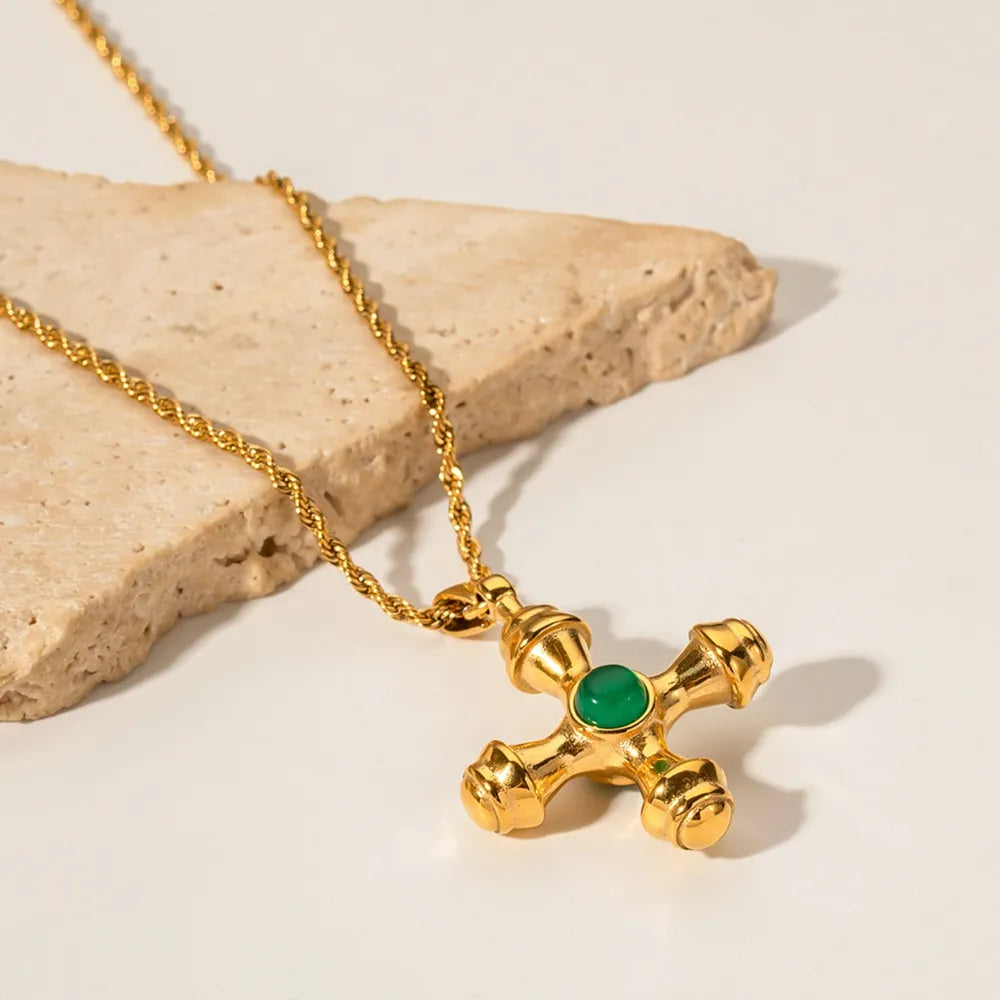 Gold-plated stainless steel cross pendant necklace with a sleek design, perfect for elegant jewelry collection.