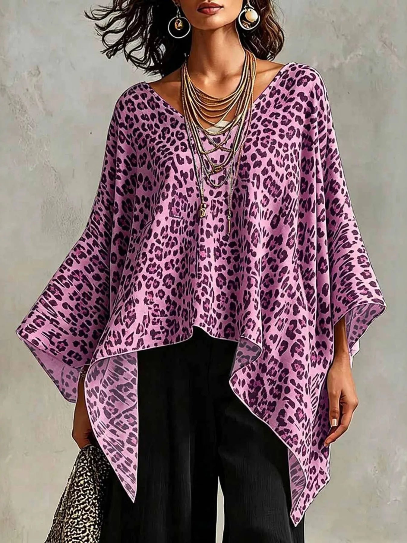 Plus size leopard print asymmetrical hem top by Trendsi, featuring a stylish, flowing design and bold animal print fabric.