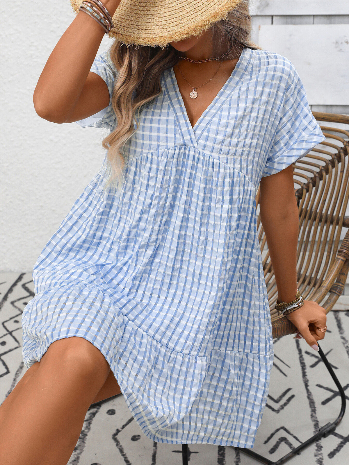 Plush Fashion Hub plaid V-neck mini dress with ruffle hem, chic and stylish for casual or semi-formal occasions.