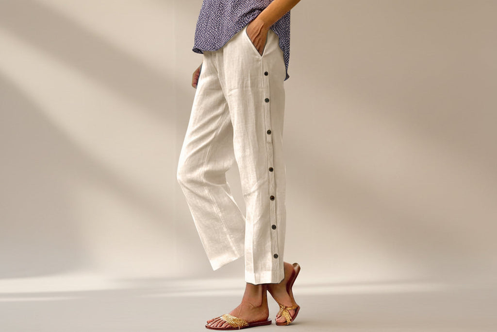 FitiqueFit casual cropped pants with decorative side seam buttons, featuring a relaxed fit and stylish design.