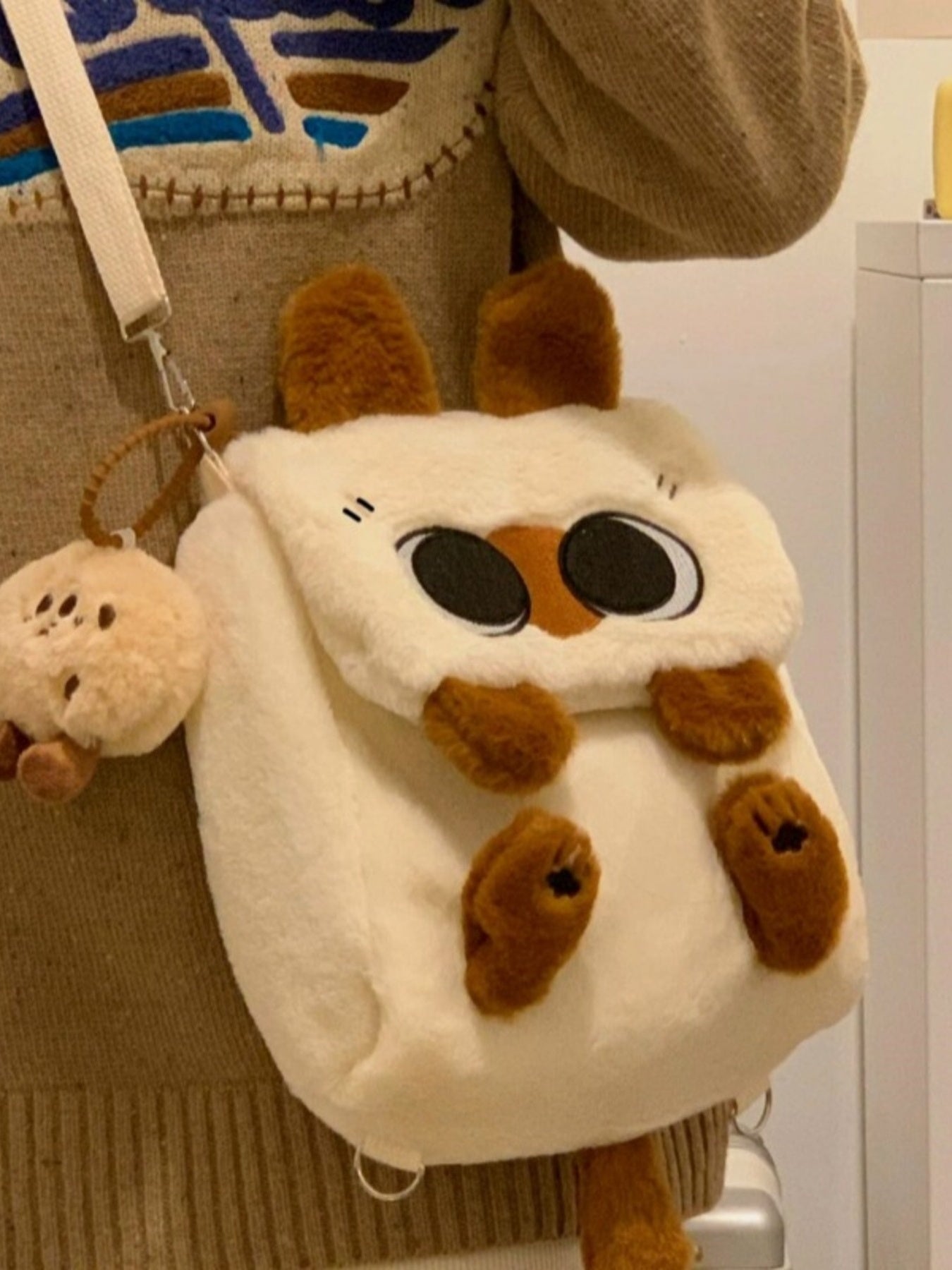 Soft woolen plush cat mini backpack by Trendsi featuring a whimsical feline design and cute, soft aesthetic for casual wear.