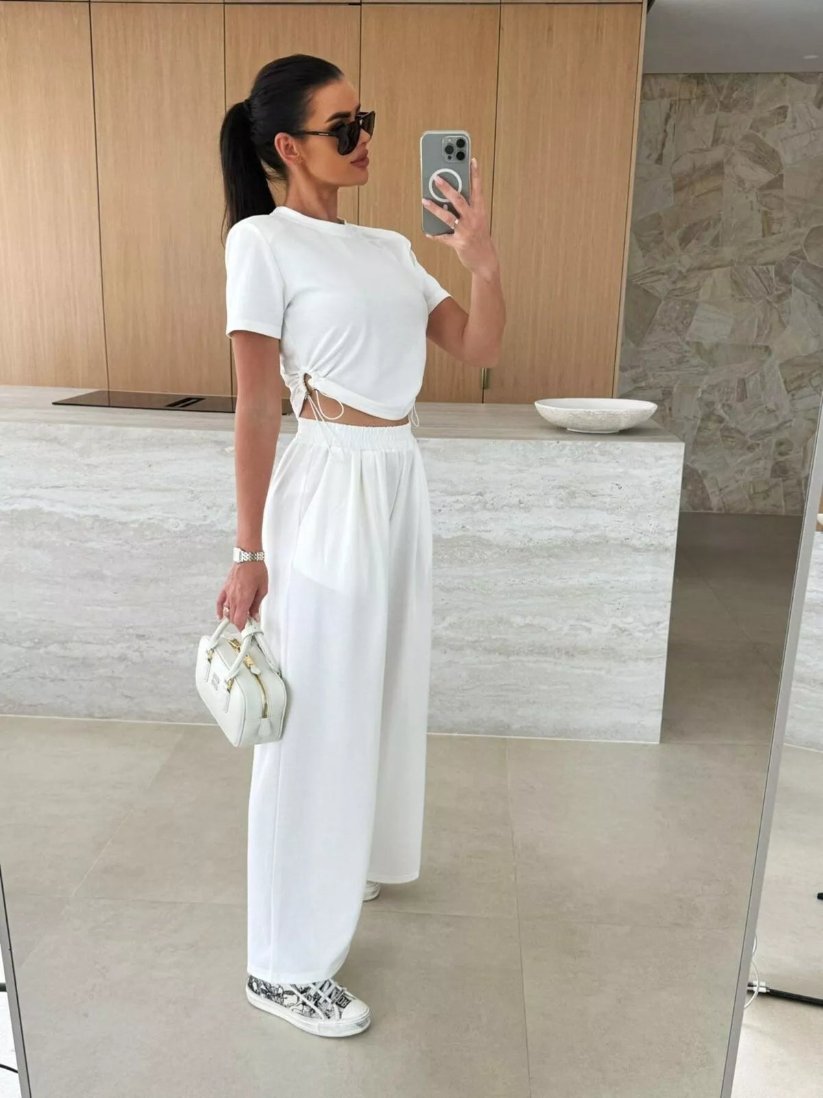 Drawstring crop top and wide-leg pants set by Plush Fashion Hub, featuring a stylish matching two-piece outfit with adjustable details.