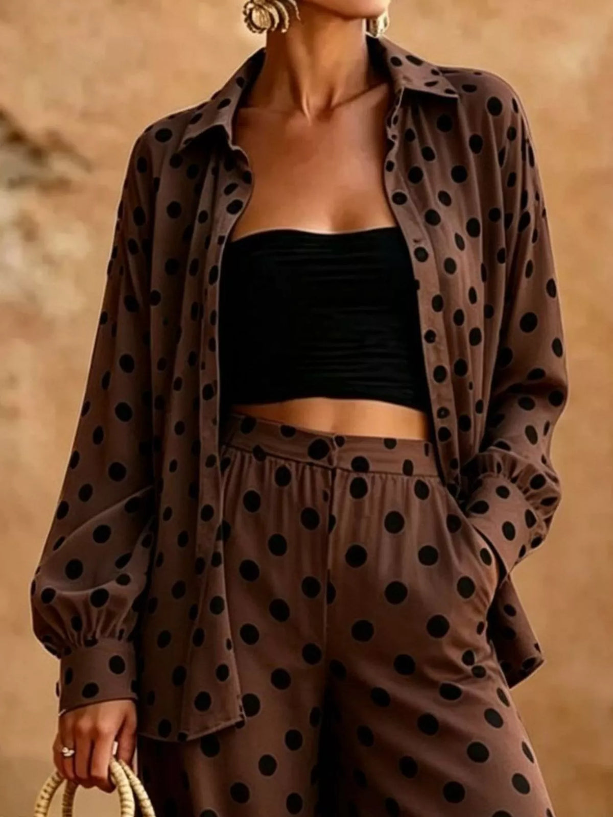 Plus size polka dot shirt and wide-leg pants set by Trendsi, featuring a stylish polka dot top and flowy matching pants.
