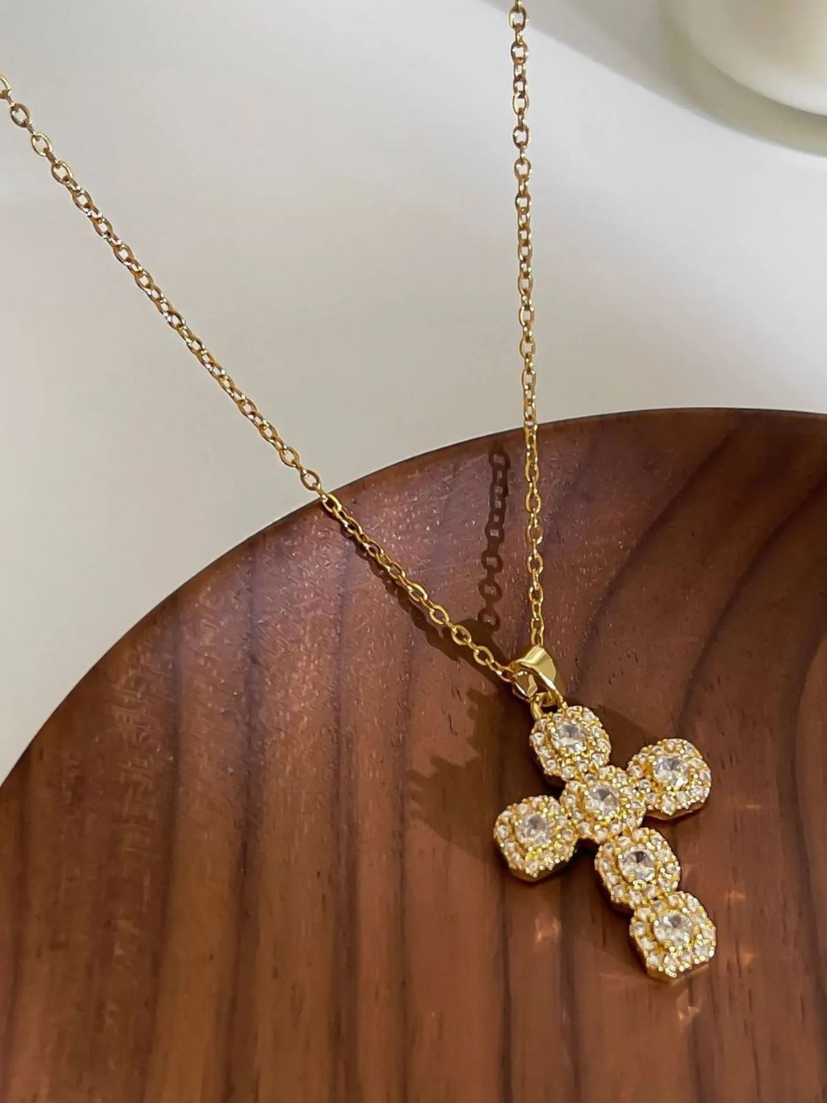 Stainless steel inlaid zircon cross necklace with polished finish, featuring a sleek pendant on a chain, ideal for stylish jewelry.