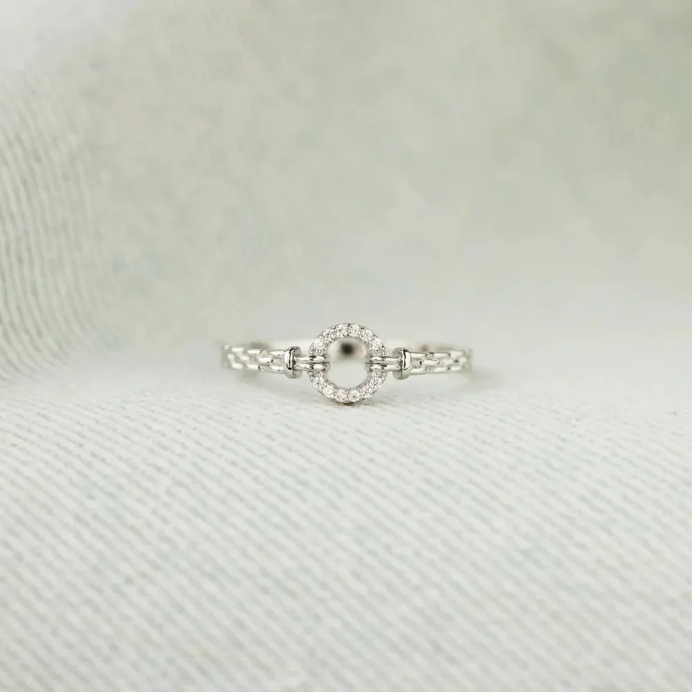 Sterling silver Zircon ring with inlaid design, featuring sparkling stones and a polished band, stylish jewelry from Plush Fashion Hub