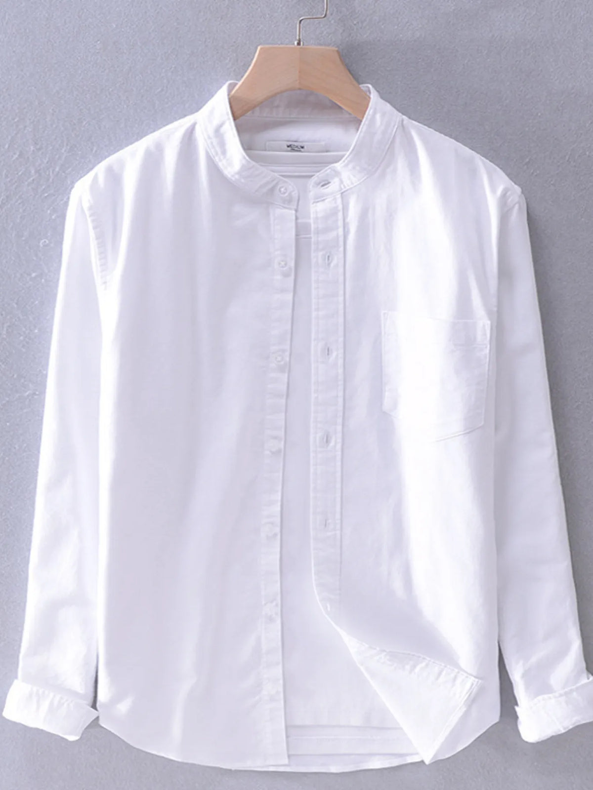 Men's plus size button-up long sleeve shirt by Trendsi, showing a comfortable and stylish men's shirt in a close-up view.