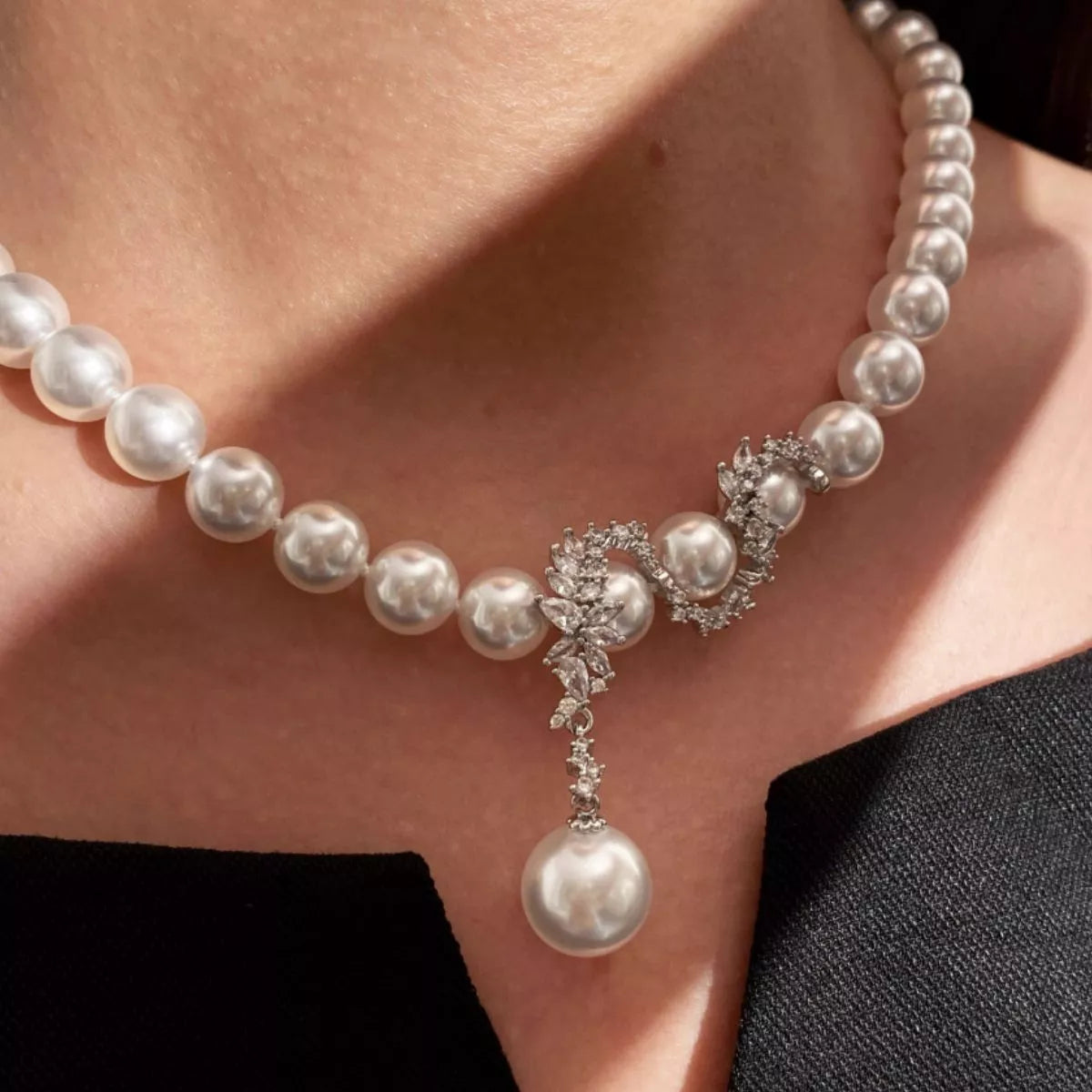 Elegant zircon pearl necklace from Plush Fashion Hub featuring shimmering pearls and a delicate chain, perfect for special occasions.