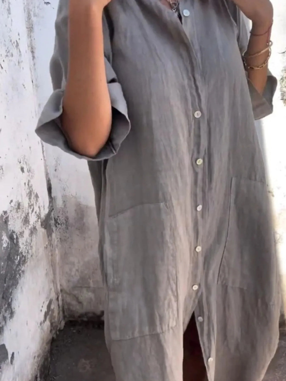 Plus size casual linen button-down shirt dress by Trendsi, featuring a relaxed fit, long sleeves, and classic collar detail.