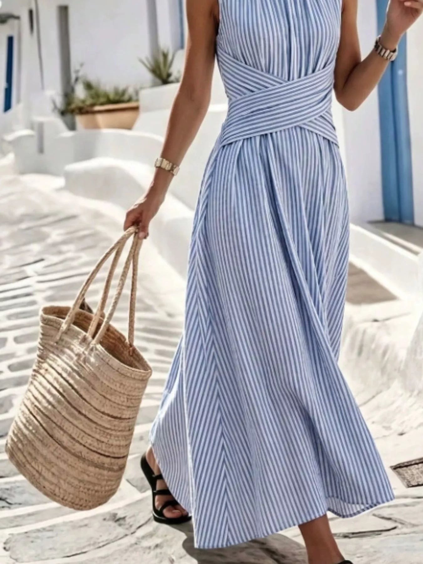 Plus size striped sleeveless maxi dress by Trendsi, featuring a colorful full-length design and comfortable fit.