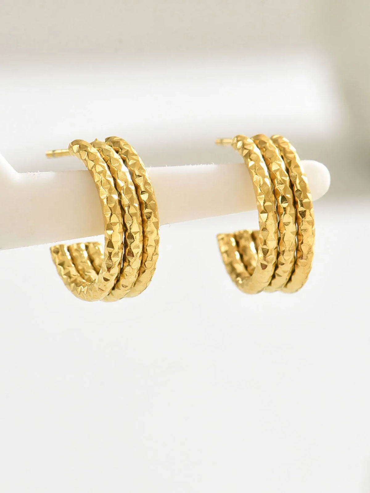 18K gold-plated textured triple band hoop earrings with a stylish, layered design for a fashionable look.