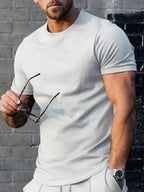 Plus size men's casual T-shirt from Trendsi in solid color, front view showing round neckline and relaxed fit.